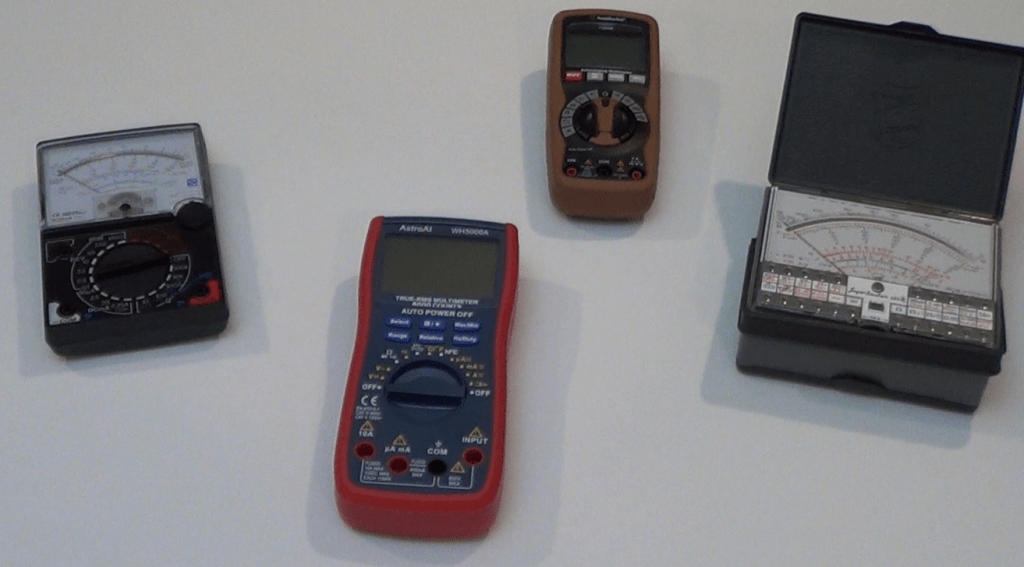Picture showing a number of multimeters, both digital and analog.